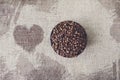 Burlap texture with coffee beans heart shape Royalty Free Stock Photo