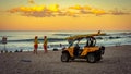 Burleigh Heads, Gold Coast, Australia - Lifeguard`s buggy parked on the beach at sunset