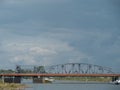 Burlington Northern railroad bridge on a sunny day, cloudy sky background