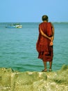 Burma. Monk Standing on Rock