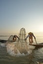 Fishman and net in Canoe sunrise Royalty Free Stock Photo