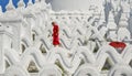 A Buddhist novice monk at white temple Royalty Free Stock Photo