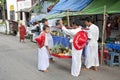 Burmese buddhist novices collecting offerings yangon myanmar Royalty Free Stock Photo