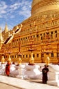 Burmese children novice stand for receive donate from burma people and foreign traveler visit respect praying at Shwezigon Pagoda