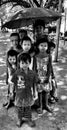 Burmese Children posing with an umbrella
