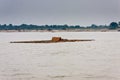 A floating raft with a family on the Irrawaddy River near Mandalay, Myanmar Royalty Free Stock Photo