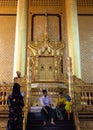 Burmese family taking a picture with smartphone. Young parents. Palace reconstructed after being burned. Royal Golden Throne, Kan