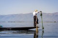 Burmese fisherman catching fish in Inle lake, Myanmar Burma by Royalty Free Stock Photo