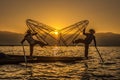 Burmese fishermen on bamboo boats at sunrise Royalty Free Stock Photo