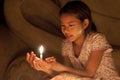 Burmese girl to pay her respect to the Buddha.