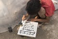 Burmese local writing old inscription on marble block, Mandalay, Burma