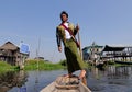 A Burmese man rowing the wooden boat on lake in Inle, Myanmar Royalty Free Stock Photo