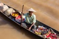 Burmese man on small long wooden boat selling souvenirs, trinkets and bijouterie at the floating market on Inle lake, Myanmar, Bur Royalty Free Stock Photo