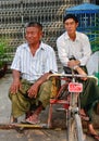 Burmese men sitting on street in Yangon, Myanmar Royalty Free Stock Photo