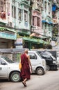 Burmese monk walking in downtown Yangon