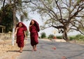 Burmese monks walking on street at Mingun village in Mandalay, Myanmar