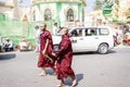 Burmese monks walking on the street of Yangon
