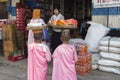 Burmese nuns collecting morning alms