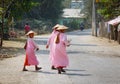 Burmese nuns walking on street at Mingun village in Mandalay, Myanmar Royalty Free Stock Photo