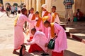 Burmese nuns women group travel visit respect praying of Shwezigon Pagoda Paya stupa chedi temple in Nyaung U town at Bagan or