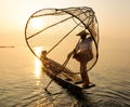 Burmese people catching fish by net on the lake in Shan, Myanmar