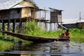 Burmese people rowing the boat on the Inle lake, Myanmar