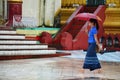 Burmese people walking at Shwemawdaw Paya Pagoda in Bago, Myanmar.