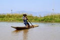 Burmese person in a boat on Inle Lake