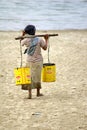 Burmese woman carrying water