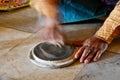 Burmese woman made powder thanaka from ground bark