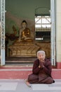 Burmese woman praying
