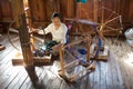 Burmese woman is spinnig a lotus thread
