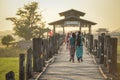 Burmese woman walk on U Bein Bridge, Myanmar