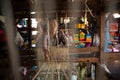 Burmese woman works with lotus root thread on a loom