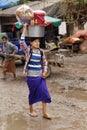 Burmese women carrying bag on head Royalty Free Stock Photo