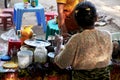 Burmese women vendor sale and cooking street food for burma people and foreign travelers select buy eat drinks in local market