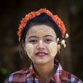 Burmese young girl with thanaka paste on her face in Mandalay, Burma, Myanmar Royalty Free Stock Photo