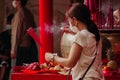 Burn a large incense stick at the place of prayer at the Petak Nine Glodok Temple, Jakarta, Indonesia