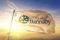 Burnaby of British Columbia of Canada flag waving on the top sunrise mist fog Royalty Free Stock Photo