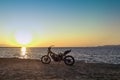 Burned abandoned motorcycle on the beach - Zakynthos / Zante island