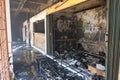 Burned building shows extensive fire damage with charred debris scattered throughout the interior Royalty Free Stock Photo