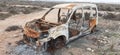 burned car abandoned, car destroyed by fire, mini van Royalty Free Stock Photo