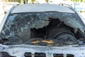 Burned car close up. Car after the fire, crime of vandalism, riots. Arson car. Accident on the road due to speeding Royalty Free Stock Photo