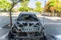 Burned car close up. Car after the fire, crime of vandalism, riots. Arson car. Accident on the road due to speeding