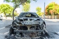 Burned car close up. Car after the fire, crime of vandalism, riots. Arson car. Accident on the road due to speeding Royalty Free Stock Photo