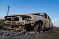 Burned down car, abstract background, selective focus. The situation of protests in the world Royalty Free Stock Photo