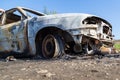 Burned down car, abstract background, selective focus. The situation of protests in the world Royalty Free Stock Photo