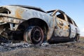 Burned down car, abstract background, selective focus. The situation of protests in the world Royalty Free Stock Photo