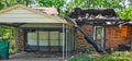 Burned Down House with Carport and Garage, Boarded Up Window Royalty Free Stock Photo
