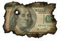 Burned fragment of US dollar banknote on white isolated background. Concept of financial crisis. Blackened charred edges of 100 Royalty Free Stock Photo